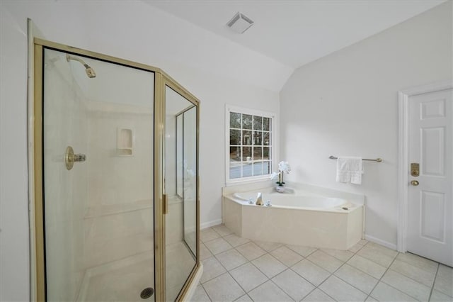 bathroom featuring plus walk in shower, lofted ceiling, and tile patterned floors