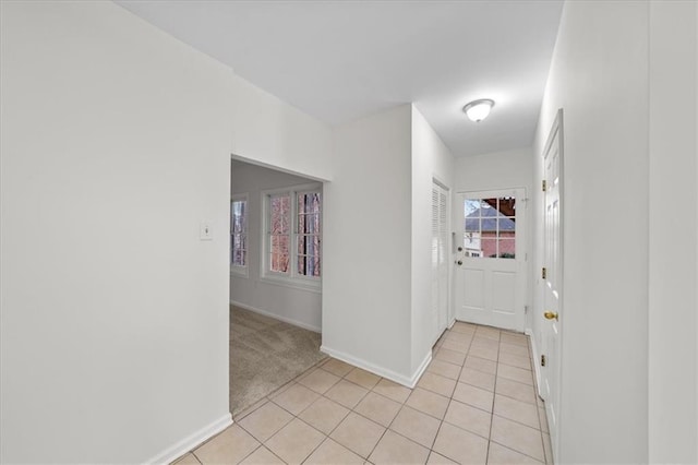 corridor with light tile patterned flooring