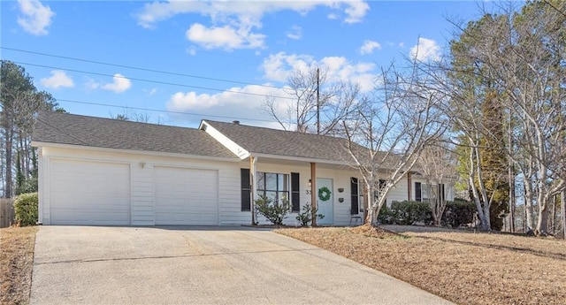 single story home featuring a garage, concrete driveway, and a shingled roof