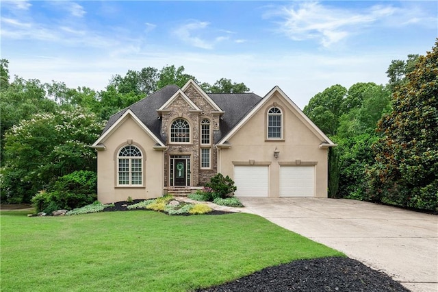 2314 Tall Timbers Ln, Marietta, GA 30066 - traditional home featuring stucco siding, driveway, a front yard, and stone siding