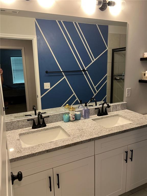 bathroom with double vanity