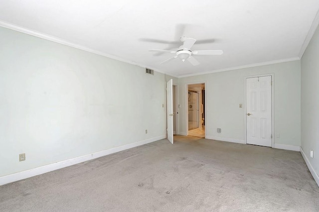 carpeted empty room featuring crown molding and ceiling fan