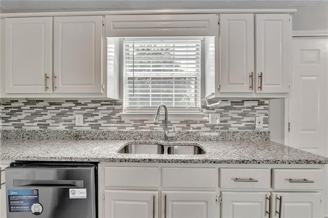 7262 Sandpiper Way, Riverdale, GA 30274 - kitchen with a sink, stainless steel dishwasher, backsplash, and white cabinets