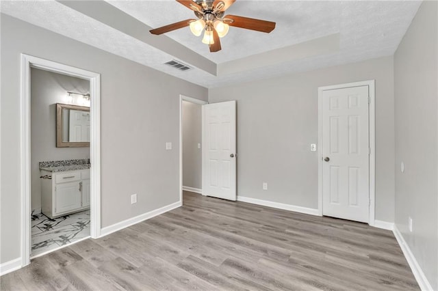 7262 Sandpiper Way, Riverdale, GA 30274 - unfurnished bedroom featuring light wood finished floors, baseboards, and a textured ceiling