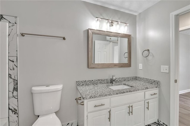 7262 Sandpiper Way, Riverdale, GA 30274 - bathroom featuring vanity, toilet, baseboards, and a shower