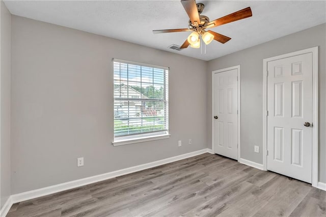 7262 Sandpiper Way, Riverdale, GA 30274 - unfurnished bedroom featuring light wood-type flooring, baseboards, and a ceiling fan
