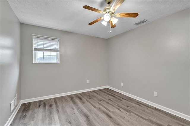 7262 Sandpiper Way, Riverdale, GA 30274 - empty room with wood finished floors, ceiling fan, baseboards, and a textured ceiling