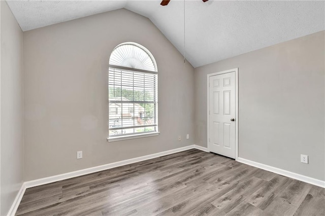 7262 Sandpiper Way, Riverdale, GA 30274 - unfurnished room featuring a ceiling fan, wood finished floors, lofted ceiling, baseboards, and a textured ceiling