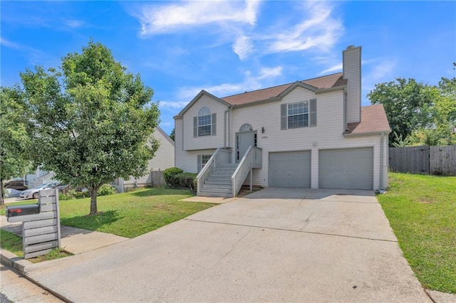 7262 Sandpiper Way, Riverdale, GA 30274 - split foyer home featuring a garage, concrete driveway, a chimney, and stairs