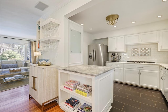 kitchen with white cabinets, stainless steel refrigerator with ice dispenser, and open shelves