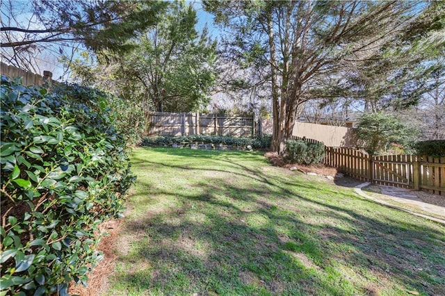 view of yard with a fenced backyard