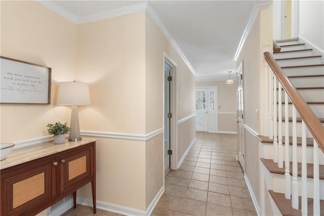 corridor with crown molding, stairway, light tile patterned flooring, and baseboards