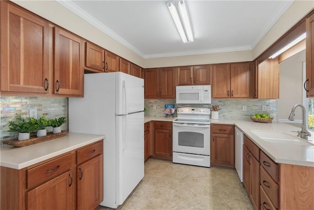 kitchen with a sink, white appliances, brown cabinets, and ornamental molding