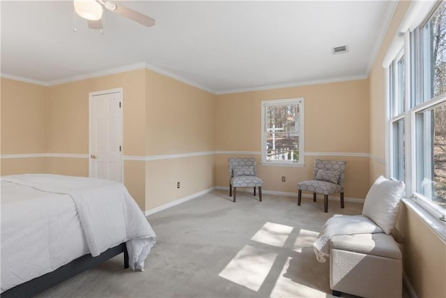 carpeted bedroom featuring visible vents, baseboards, and ornamental molding