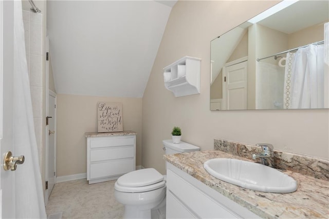 bathroom featuring vanity, lofted ceiling, toilet, and a shower with shower curtain