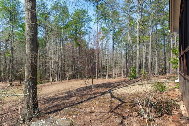 view of yard with a forest view