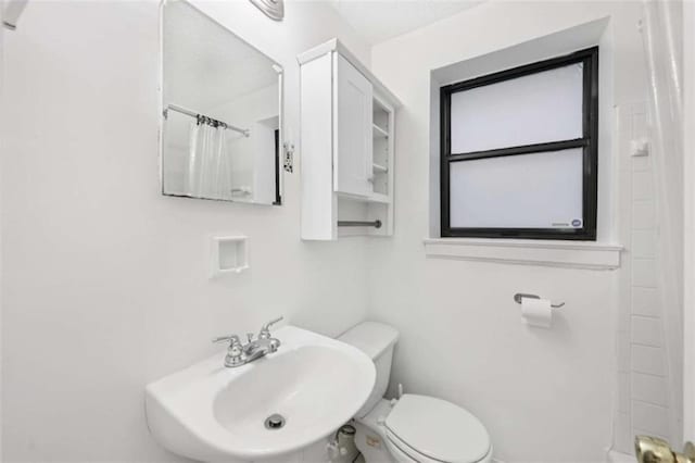 330 3rd St Apt 1, Atlanta, GA 30308 - full bath with a sink, a shower with shower curtain, and toilet