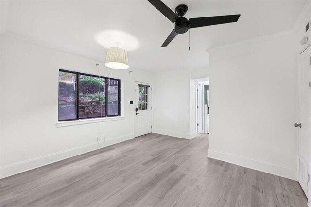330 3rd St Apt 1, Atlanta, GA 30308 - spare room with a ceiling fan, wood finished floors, baseboards, and crown molding
