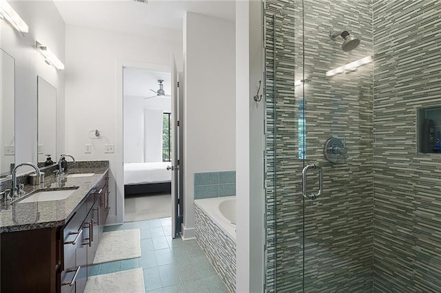 bathroom with ceiling fan, tile patterned floors, vanity, and plus walk in shower