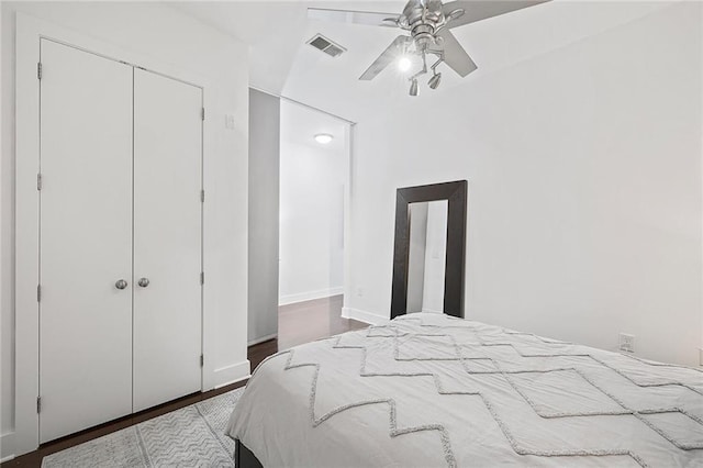 bedroom with ceiling fan, hardwood / wood-style floors, and a closet