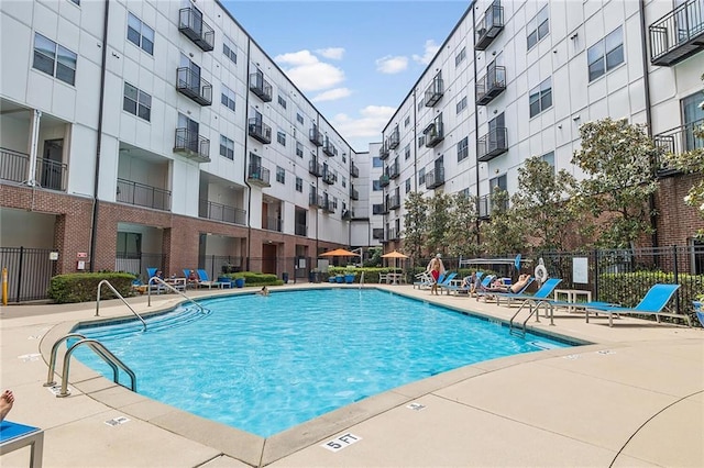 view of swimming pool with a patio