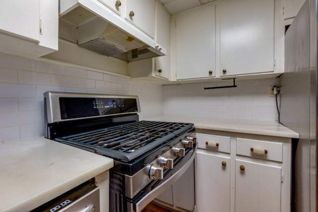 kitchen featuring tasteful backsplash, stainless steel appliances, and white cabinets