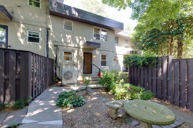 view of front of home featuring ac unit