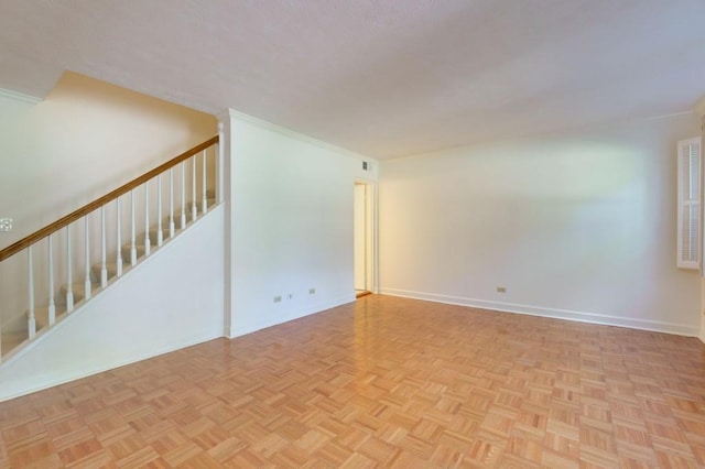 spare room with light parquet floors