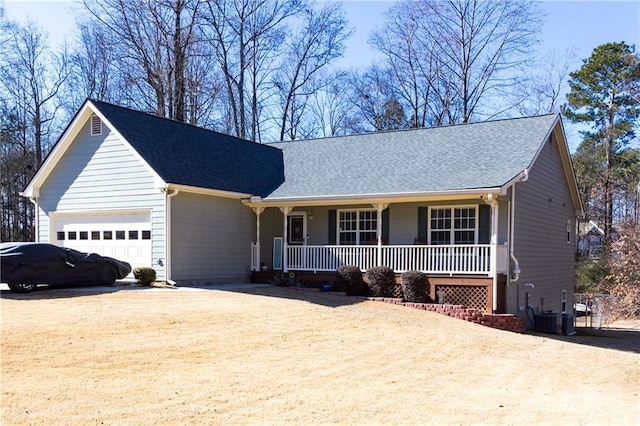 ranch-style home featuring a garage, a porch, and central AC unit