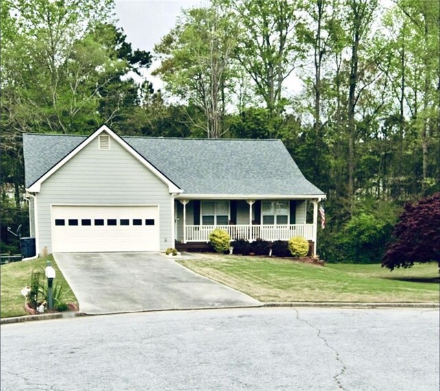 ranch-style home featuring a garage, a porch, and cooling unit