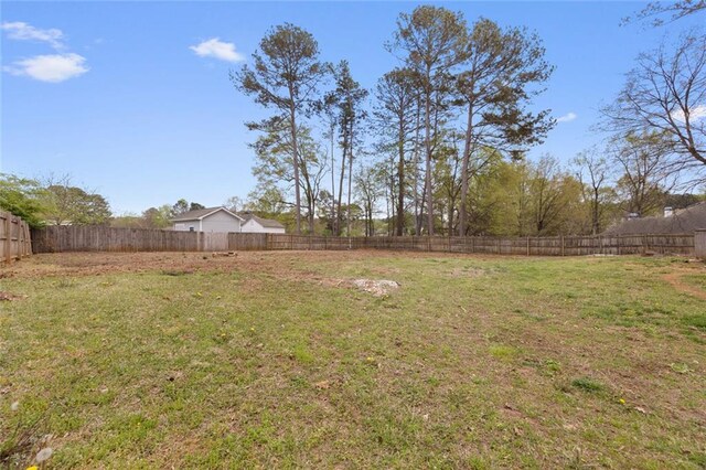 view of yard with a fenced backyard