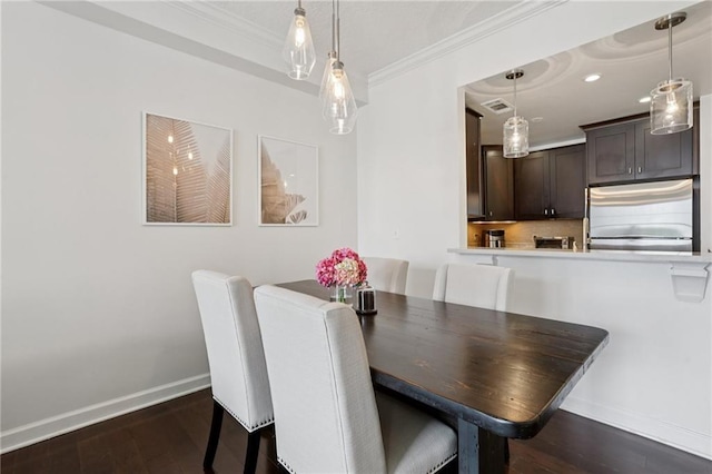 1101 Juniper St NE Unit 1012, Atlanta, GA 30309 - dining space featuring ornamental molding, baseboards, and dark wood-type flooring