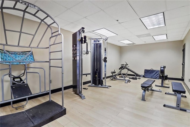 1101 Juniper St NE Unit 1012, Atlanta, GA 30309 - workout area featuring wood finished floors, baseboards, and a drop ceiling