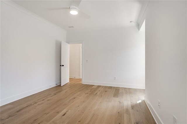 unfurnished room with ceiling fan, light hardwood / wood-style flooring, and crown molding