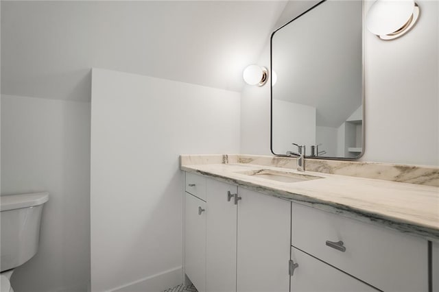 bathroom with vanity and toilet