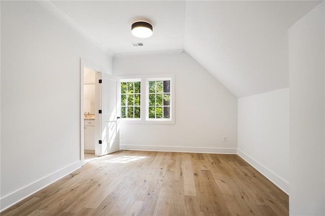 bonus room featuring light hardwood / wood-style floors and lofted ceiling