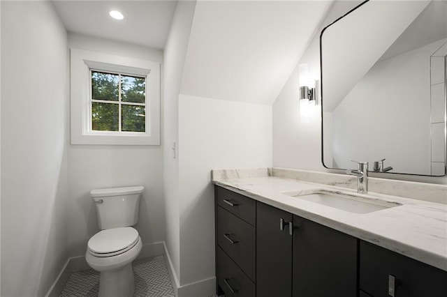 bathroom featuring tile patterned floors, vanity, and toilet