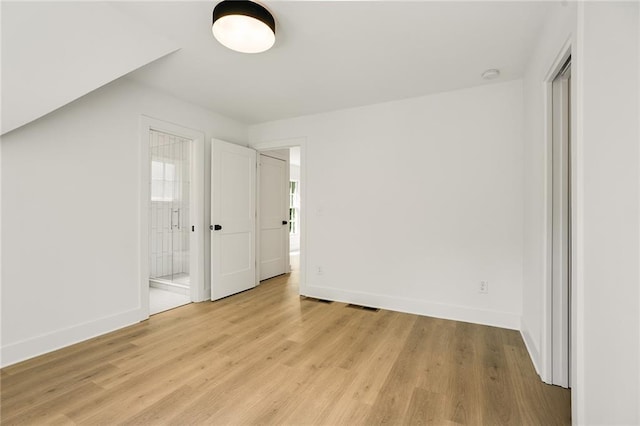 unfurnished bedroom with light hardwood / wood-style flooring