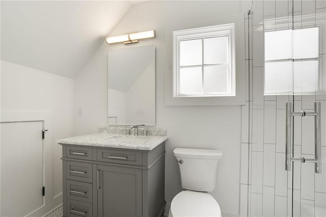 bathroom featuring walk in shower, vanity, vaulted ceiling, and toilet