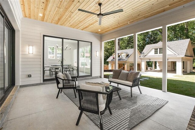 sunroom / solarium with ceiling fan and wood ceiling