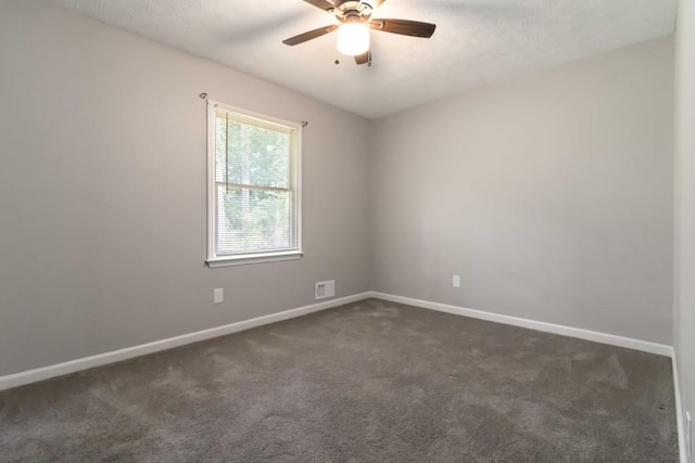1353 Litchfield Ct, Snellville, GA 30078 - spare room featuring a ceiling fan, baseboards, and dark colored carpet