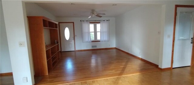 entrance foyer with ceiling fan and hardwood / wood-style floors