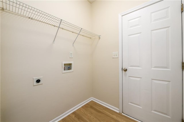 washroom with washer hookup, wood finished floors, baseboards, hookup for an electric dryer, and laundry area