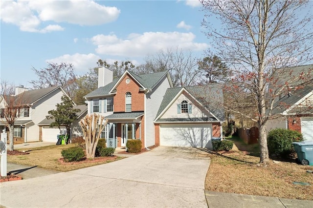 view of front of house featuring driveway and a chimney