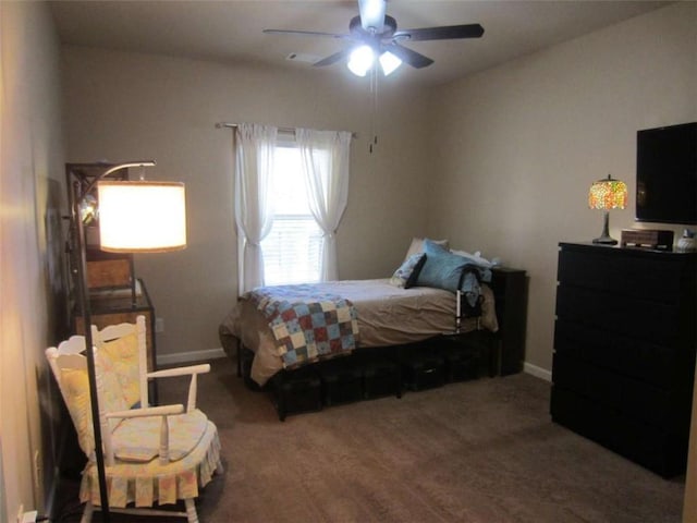 carpeted bedroom featuring a ceiling fan and baseboards