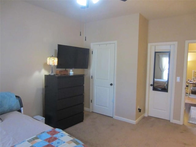 bedroom featuring baseboards and carpet flooring