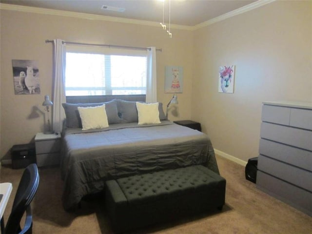 carpeted bedroom with crown molding, baseboards, and visible vents