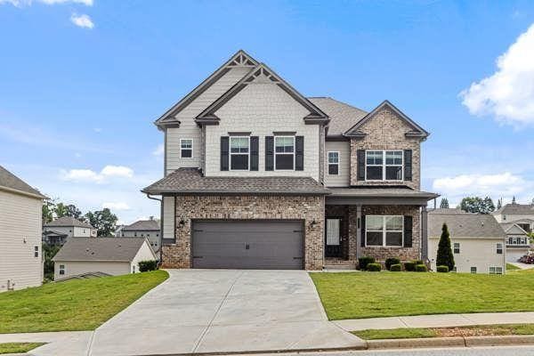 1494 Weeping Tree Cir, Auburn, GA 30548 - craftsman-style home with concrete driveway, a front lawn, brick siding, and a garage