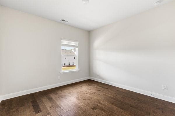 1494 Weeping Tree Cir, Auburn, GA 30548 - spare room featuring dark wood finished floors and a smoke detector