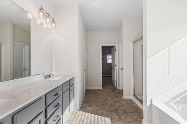 1494 Weeping Tree Cir, Auburn, GA 30548 - bathroom featuring double vanity, a garden tub, and a shower